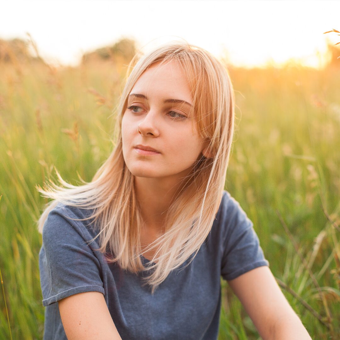 A young lady thinking about pregnancy symptoms